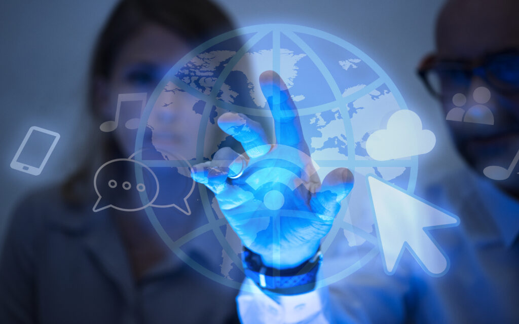 Two professionals interacting with a virtual interface of internet icons and a digital globe, representing global connectivity and data access, symbolic of concepts like static and rotating proxies used in web scraping.